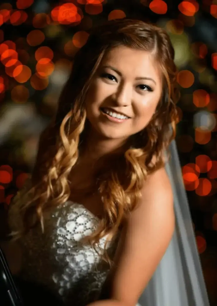 Smiling bride with bokeh lights background